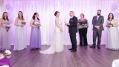 This image shows the wedding vows taking place in front of translucent drapery which we hung and backlit with uplighting in the bridal colours. Photo by David Marasigan Photography.
